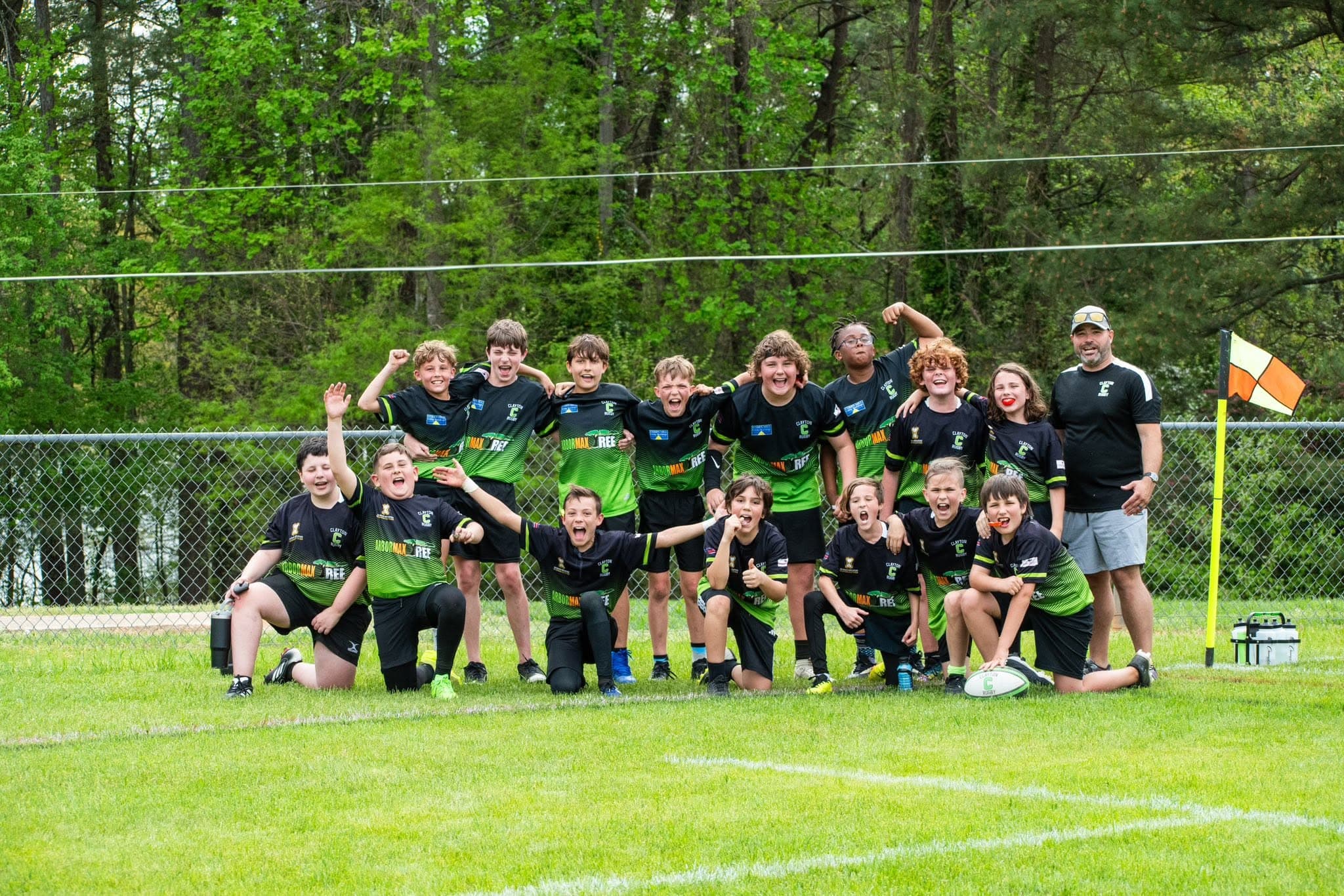 Clayton Rugby youth team celebrating on the pitch
